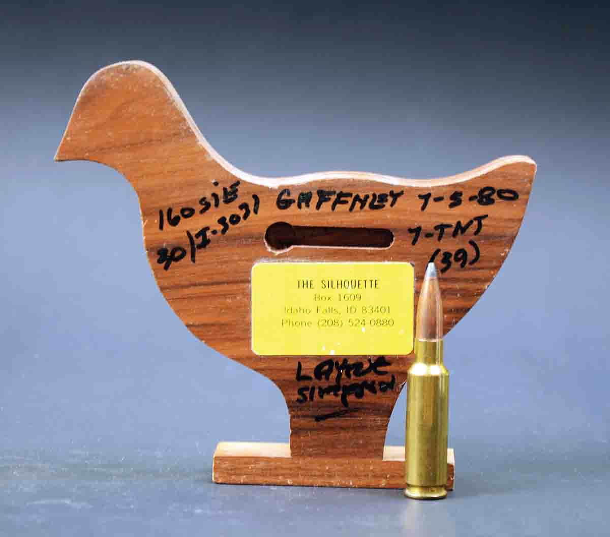This unlimited-class trophy was awarded to Layne after he shot a 39x40 in his very first match in 1980. On it he wrote other information, including the powder and bullet used in the 7mm TNT.